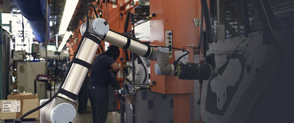 Automation experts programming collaborative robot