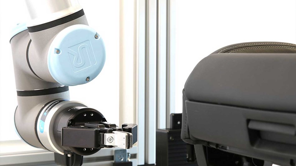 The UR10e is equipped with a UR+ certified gripper from Robotiq that actuates buttons and switches on the car seats.